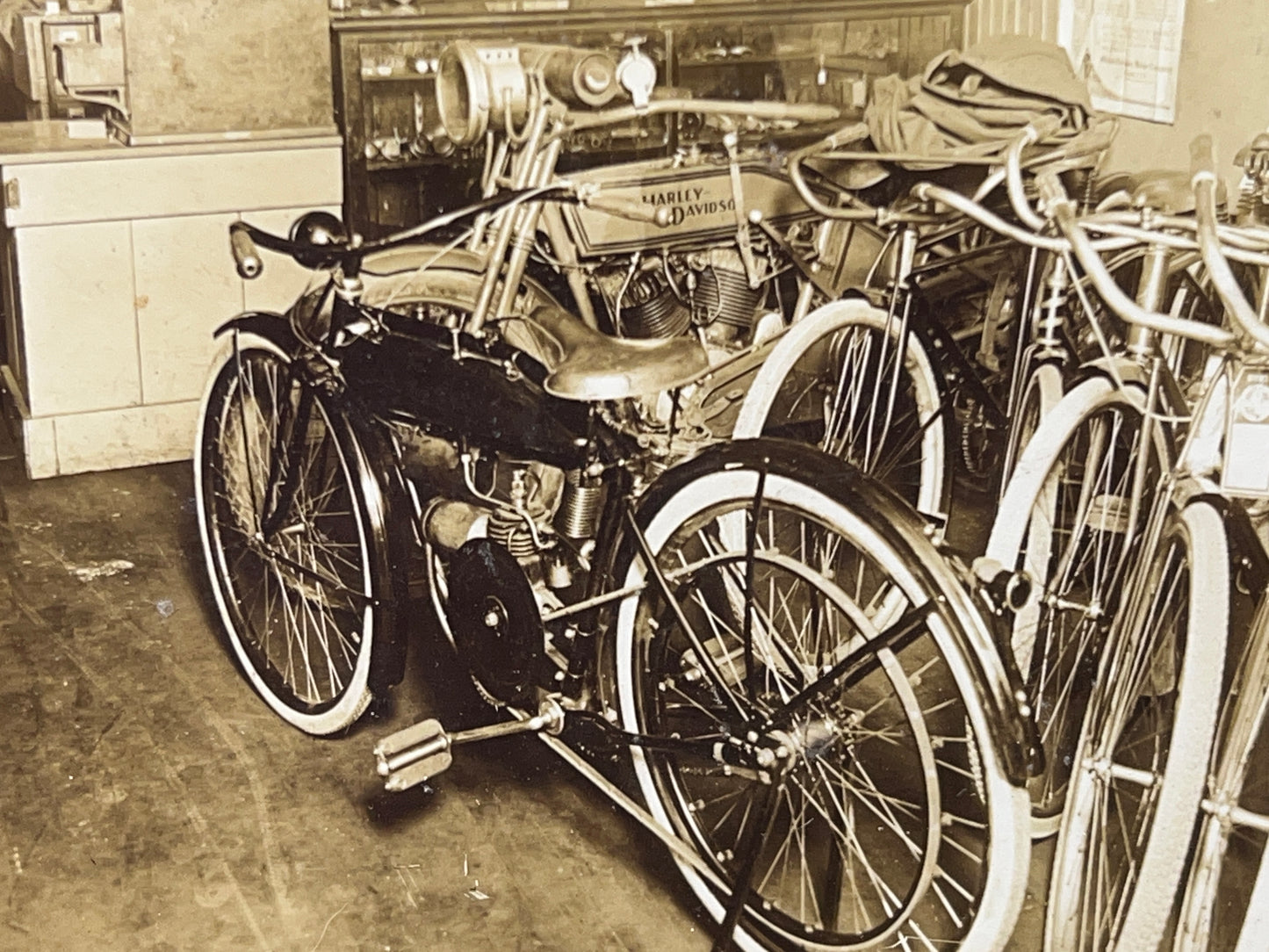 1915 Harley Davidson and Shaw Motorcycles in a Bicycle Shop Photo